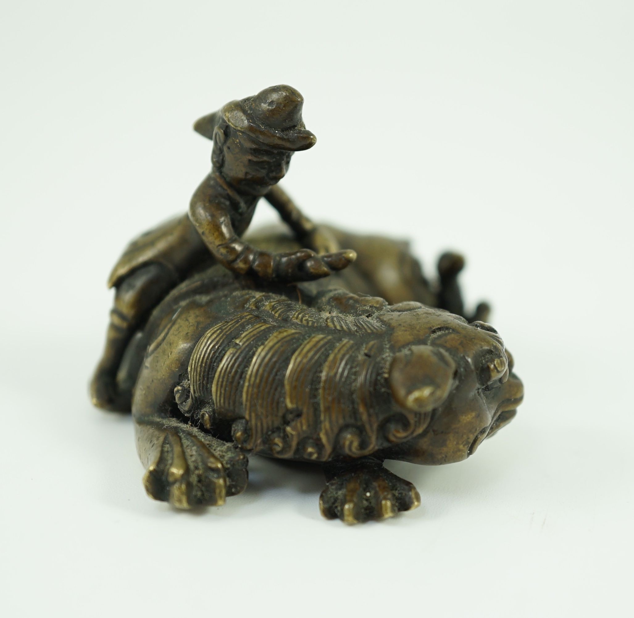 A Chinese bronze ‘Buddhist lion’ scroll weight, 17th/18th century, 6.5cm long